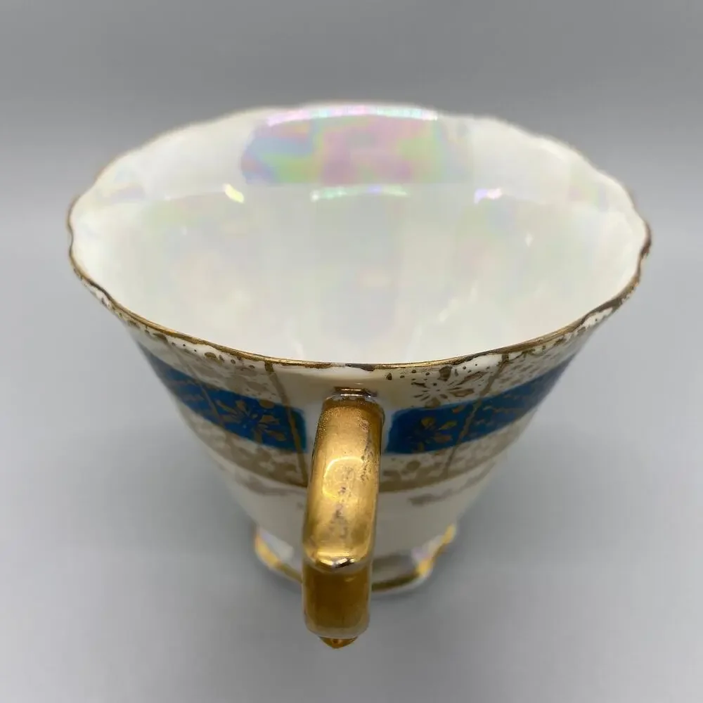 Vintage Porcelain Lusterware Tea Cup with Blue and Gold Toned Floral Design